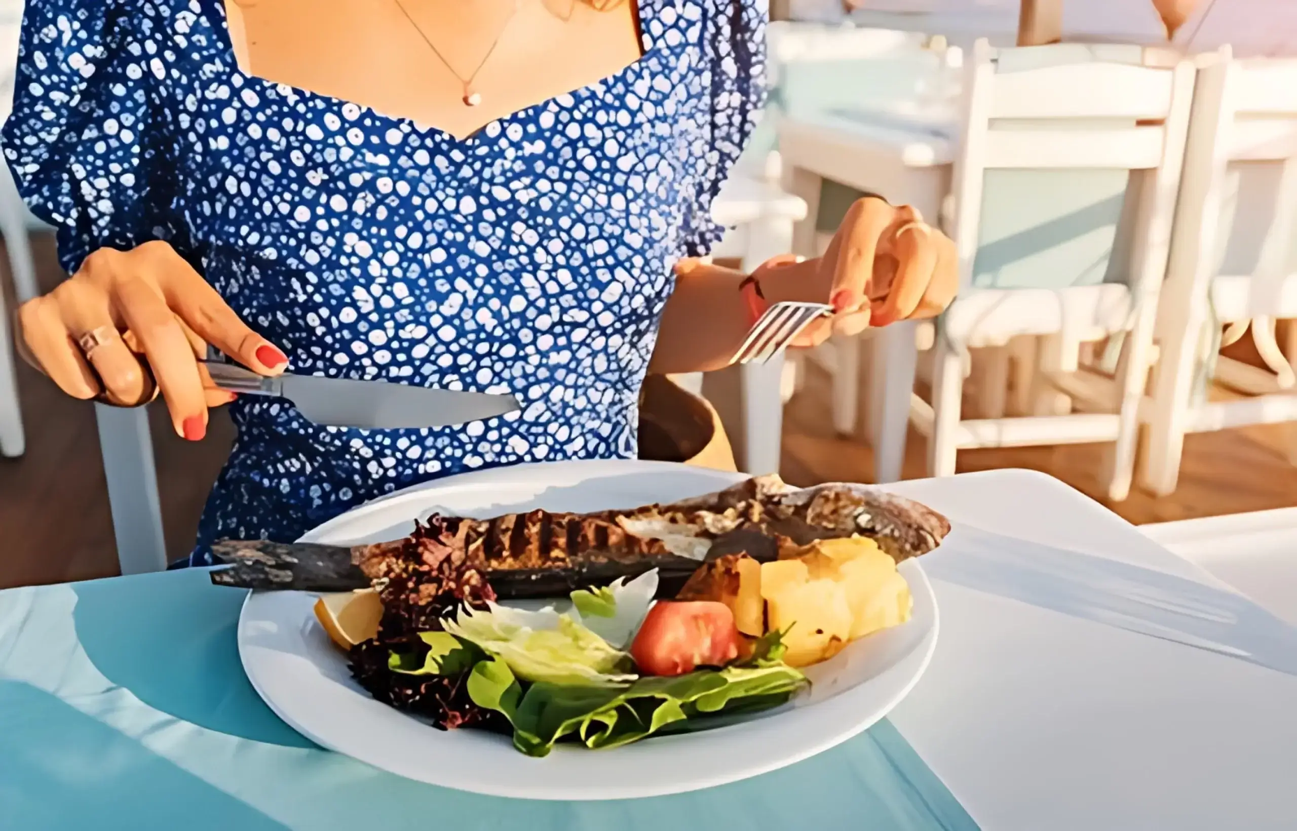 women eating bass